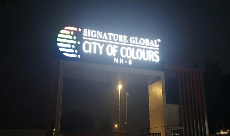 Illuminated glow signage for Signature Global City of Colours at night